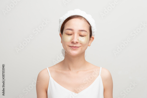 Wallpaper Mural Asian beauty teenager woman care her skin with eye masks patches under eyes Torontodigital.ca