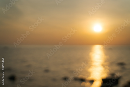Blurred background of beach during sunset