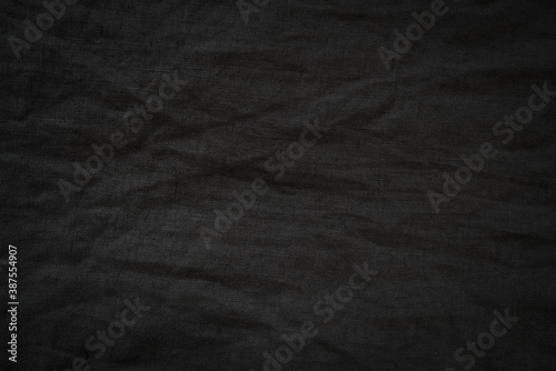 crumpled black linen cloth background