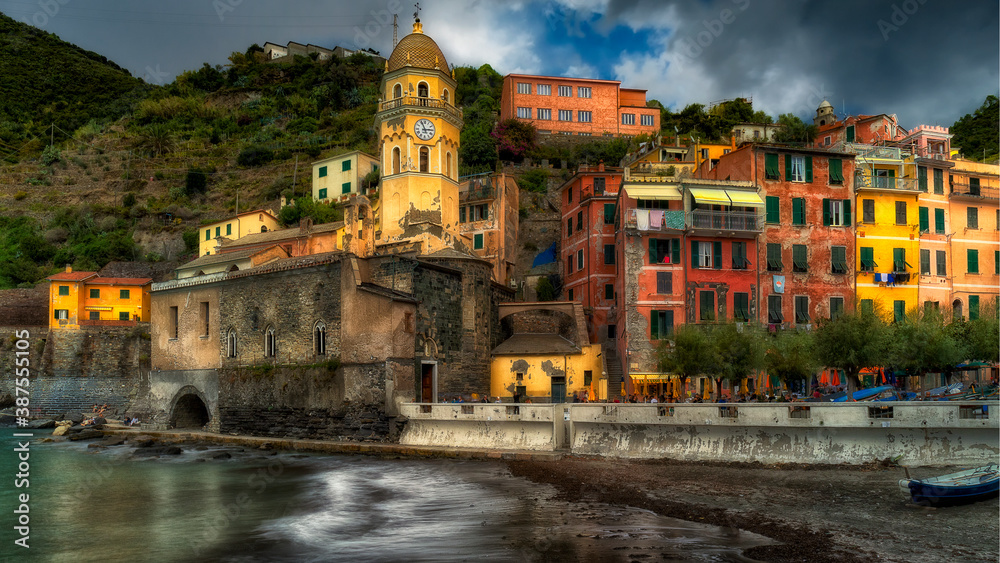 Late afternoon sunshine hitting the buildings around the harbour of Vernazza in Italy's Cinque Terre