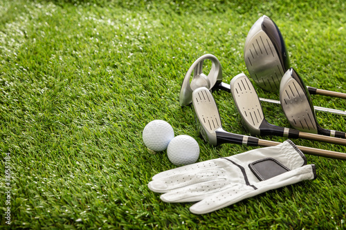 Golf equipment on green grass golf course, close up view. photo