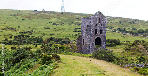An old ruined Cornish mine building and rail trackbed near Caradon Hill and Minions, Cornwall, England, UK. photo