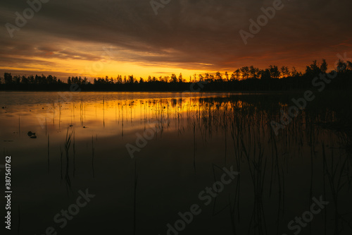 sunset over the lake © Evgenii Ryzhenkov