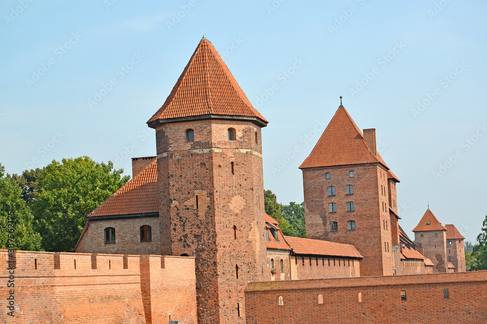 View of the towers and the fortress wall of the knight's castle of the Teutonic order. Malbork, Poland