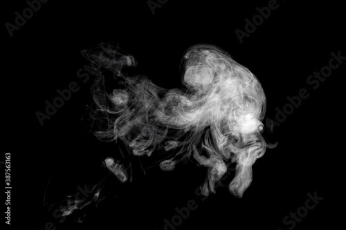 Movement of abstract beautiful cloud of white smoke isolated on black background.