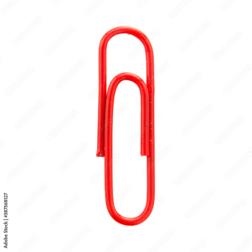 Red paper clip isolated on white background, top view. Red paper clip on a white background, top view. Red paper clip isolated on white background, close-up. Red paper clip isolated on white background, top view. Red paper clip on a white background, top view. Red paper clip isolated on white background, close-up.