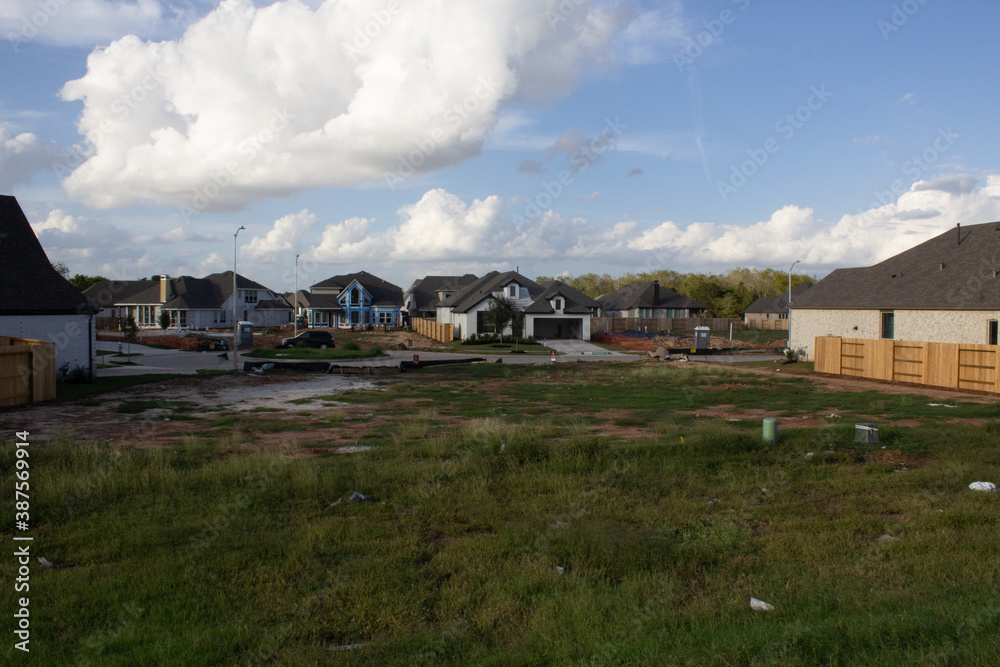 Neighborhood Being Built with Undergoing Construction, Built Homes and Some Empty Lots