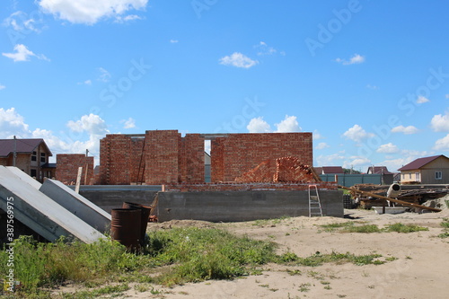 construction of a brick house cottage in the village on the construction site