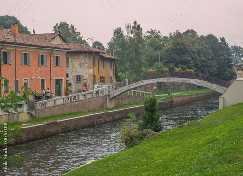 bridge and old farmhouses on the Naviglio Grande in the Lombard countryside near Milan.Italy © gpriccardi