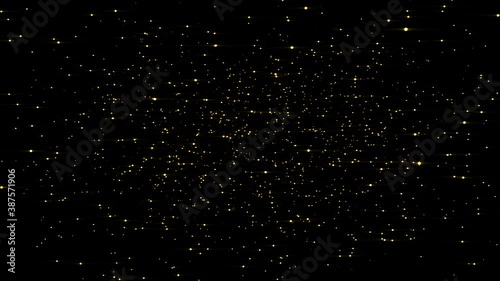 Abstract magic gold dust fly in the dark. Beautiful golden dust particles glimmering on black background slowly fly.