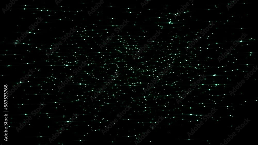 Abstract magic colored dust fly in the dark - Elegant colored dust particles glimmering on black background slowly fly.