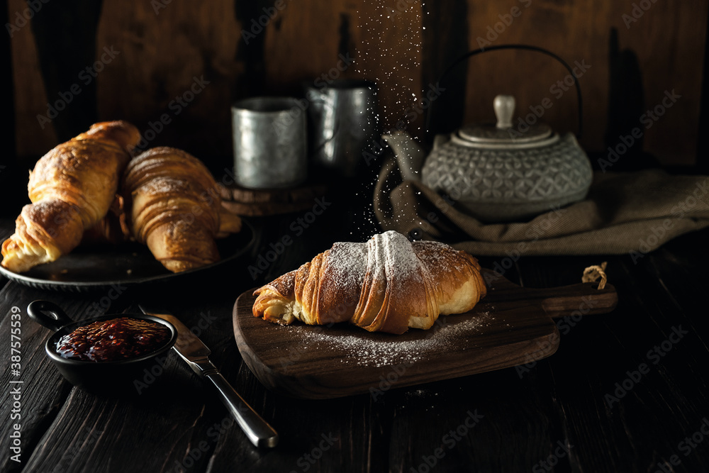 Croissants with raspberry jam and powdered sugar