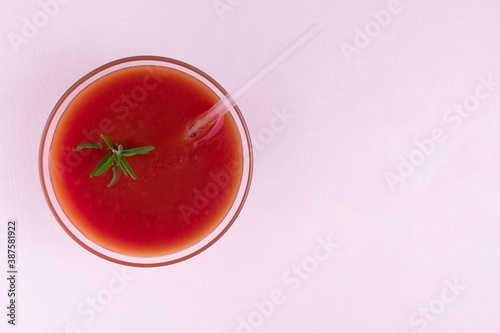 
Glass of tomato juice on a white background. Flat lay.
Copy space.