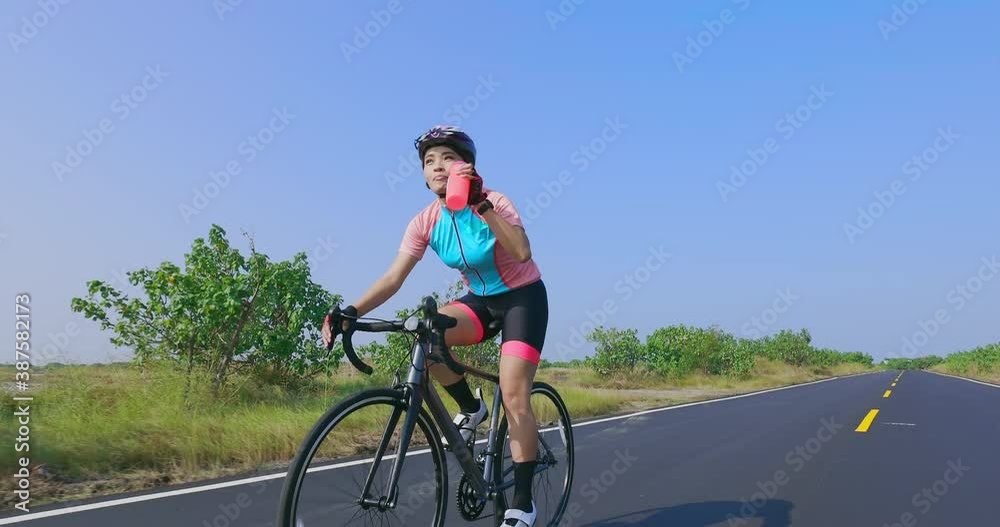 Asian young woman riding bicycle Asian young woman riding bicycle