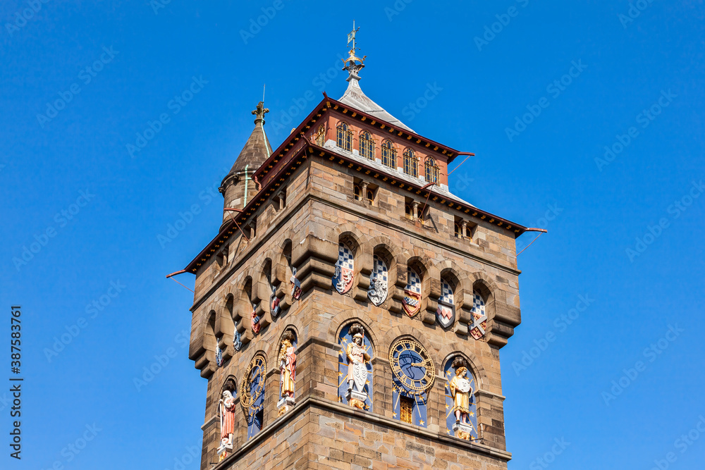 The clock tower of Cardiff Castle Wales UK completed in 1873 which is part of the wall of the 12th century Norman fort which is a popular tourism travel destination attraction landmark of the city 