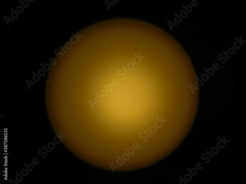 yellow lamp in the shape of a sphere