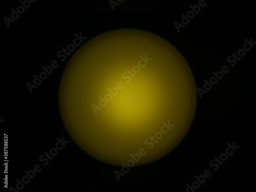 yellow lamp in the shape of a sphere