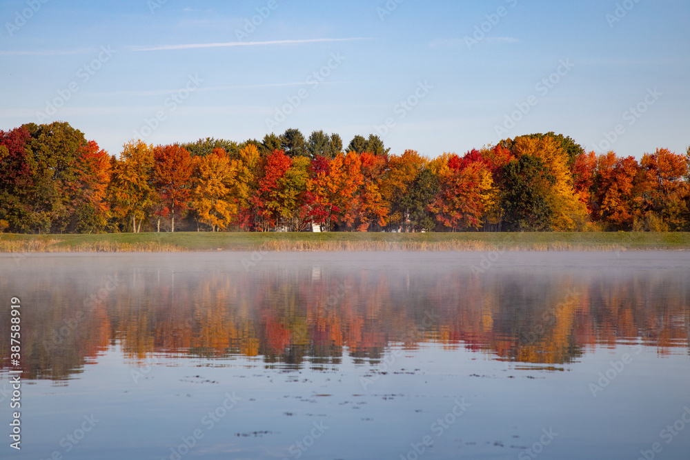 Fall foliage reflects in lake