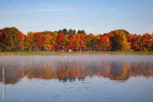 Fall foliage reflects in lake