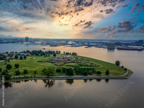 Aerial view of Fort McHenry in Baltimore, site of the epic 1812 battle, birthplace of the Star Spangled Banner with dramatic colorful sky photo