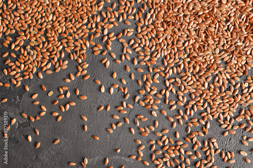 Dry flax seeds texture background.