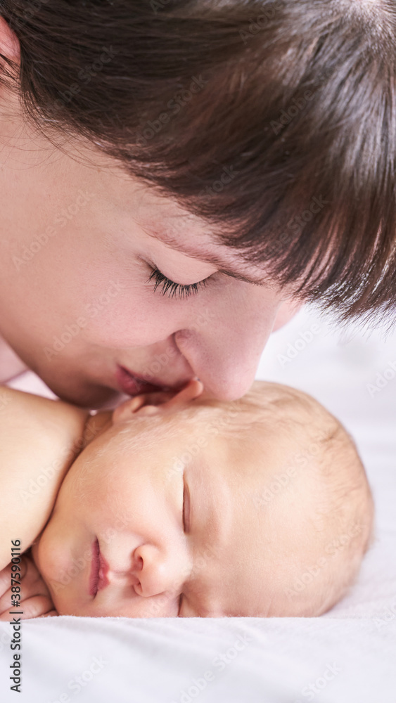 Tiny newborn. Mother touch little people. Healthcare massage concept. Modern parenthood. Comfort and safety sleep on bed. Human insurance. Family miracle. Closed eyes Tiny newborn. Mother touch little people. Healthcare massage concept. Modern parenthood. Comfort and safety sleep on bed. Human insurance. Family miracle. Closed eyes