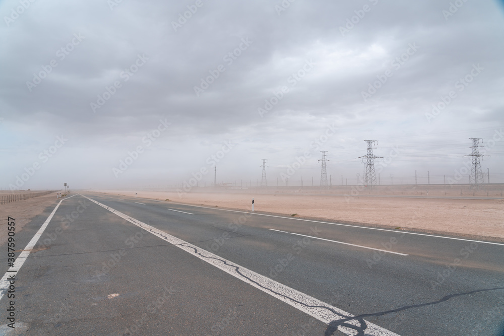 Fototapeta premium electric power station and road in desert