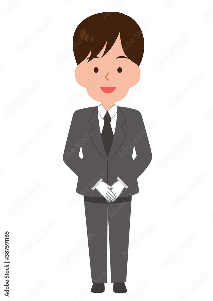 手を前で組んで立つ男性スタッフ