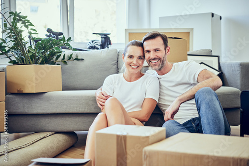 Portrait of adult couple moving to new home