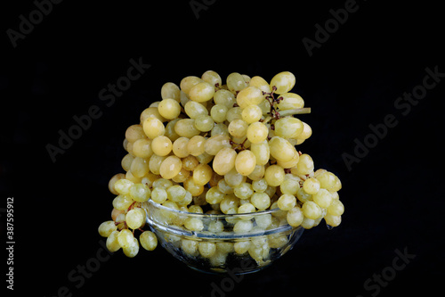 Yellow grapes on dark background