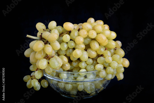 Yellow grapes on dark background