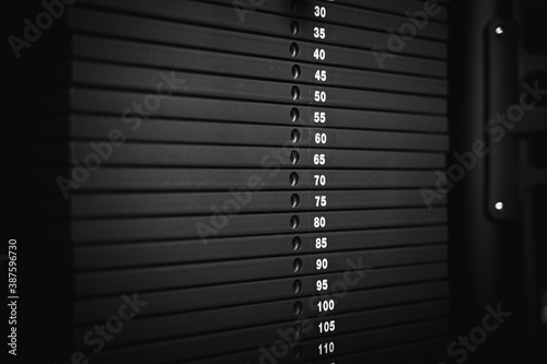 Stacked metal weights in a gym machine