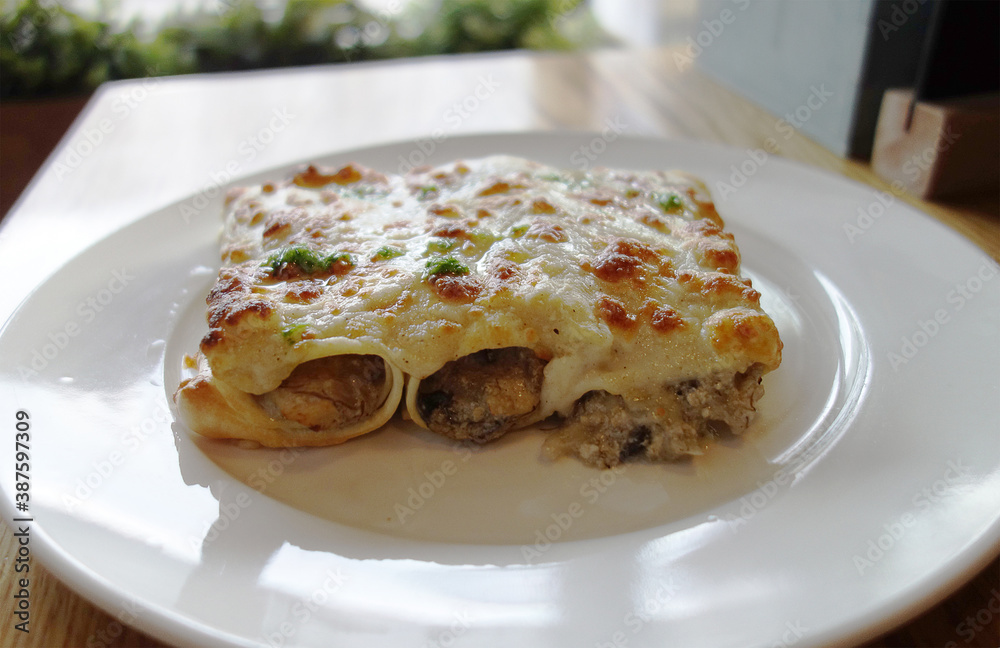 lunch break white plate with baked minced beef with mushrooms and cheese, delicious and fresh food concept. lunch break white plate with baked minced beef with mushrooms and cheese, delicious and fresh food concept.