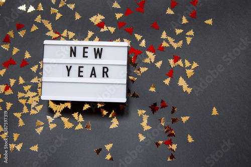 Christmas gray photophone with a sign with the inscription and sequins photo