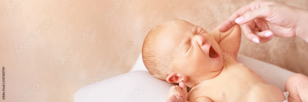 Tiny newborn. Mother touch little people. Healthcare massage concept. Modern parenthood. Comfort and safety sleep on knees. Human insurance. Family miracle. Closed eyes and yawn. Copyspace. Banner Tiny newborn. Mother touch little people. Healthcare massage concept. Modern parenthood. Comfort and safety sleep on knees. Human insurance. Family miracle. Closed eyes and yawn. Copyspace. Banner