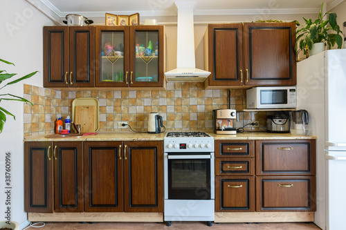 Kitchen set for dark wood in a standard apartment