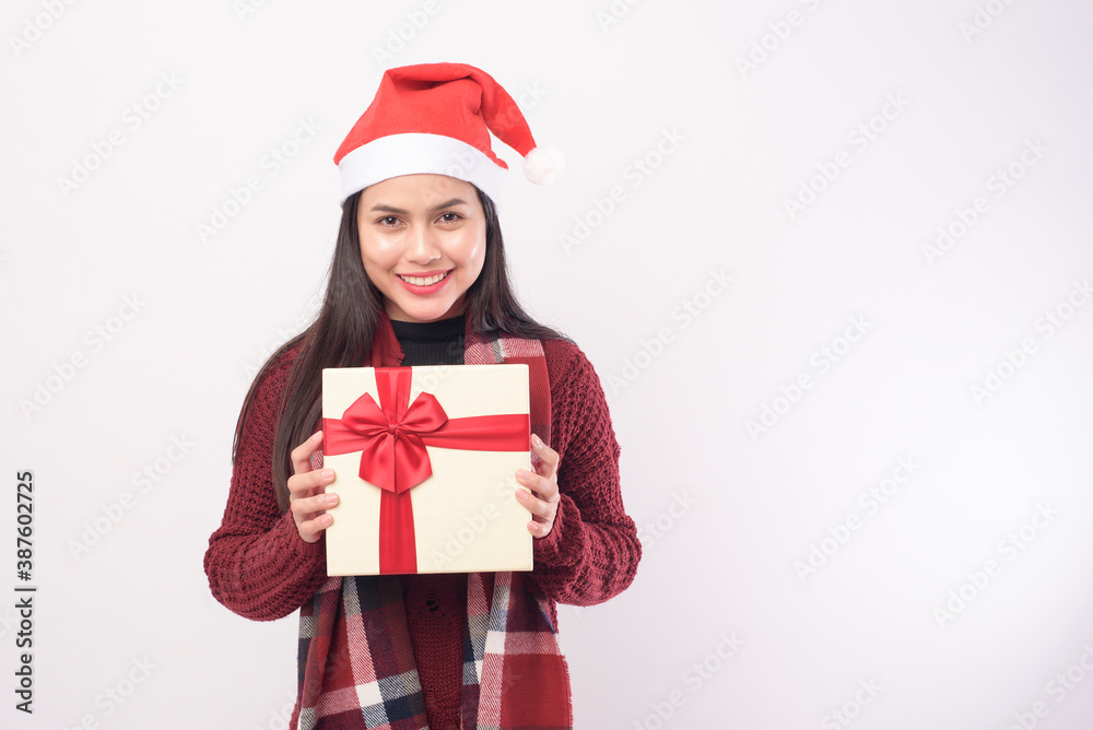 Portrait of young smiling woman wearing red Santa Claus hat isolated white background studio. Portrait of young smiling woman wearing red Santa Claus hat isolated white background studio.