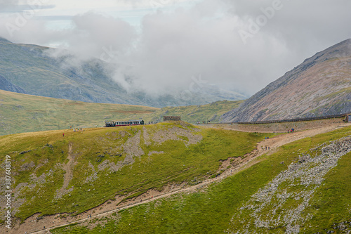 View from Ranger Path at Llanberis Path with a mountain train route to the Yr Wyddfa peak - foreland of Snowdon. Highest mountain range in Wales. photo