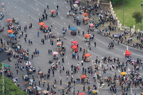 Wall Mural Aerial top view of flash mobs protesters demonstration rally on street road against government, crowd of people in Bangkok City, Thailand in public for democracy