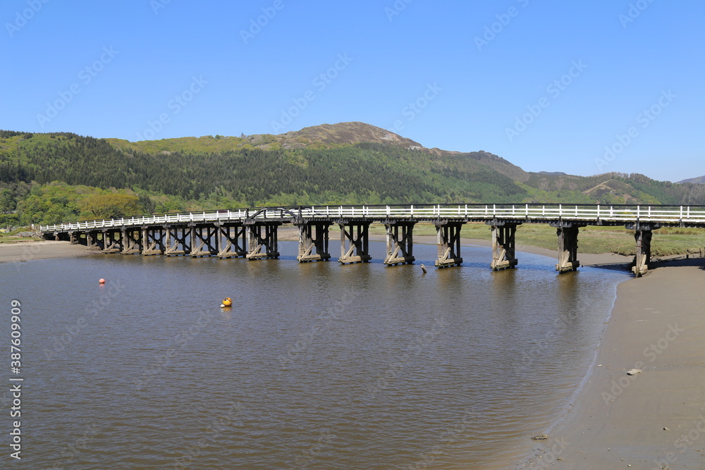 The toll road bridge across Mawddach River at Penmaenpool, Gwynedd, Wales, UK.