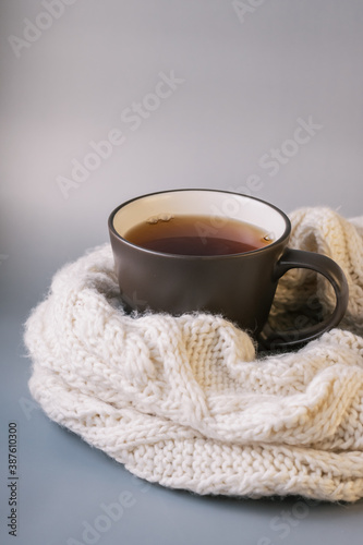 Autumn tea. Sweater, maple leaves, cookies and cup of tea with lemon.