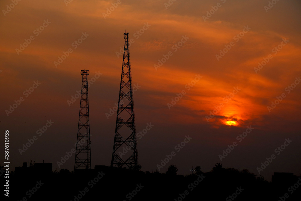 sunset view with two telecommunication tower