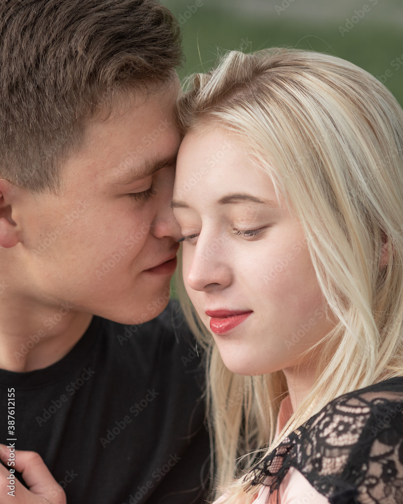 Close-up of young romantic couple is kissing Close-up of young romantic couple is kissing