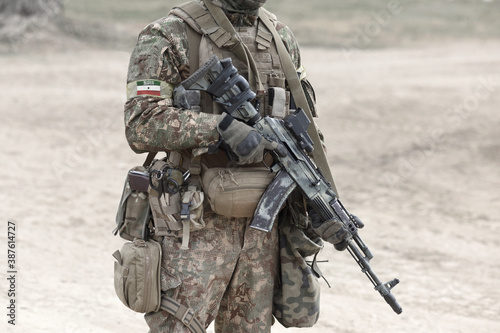Soldier with assault rifle and flag of Somaliland on military uniform. Collage. photo