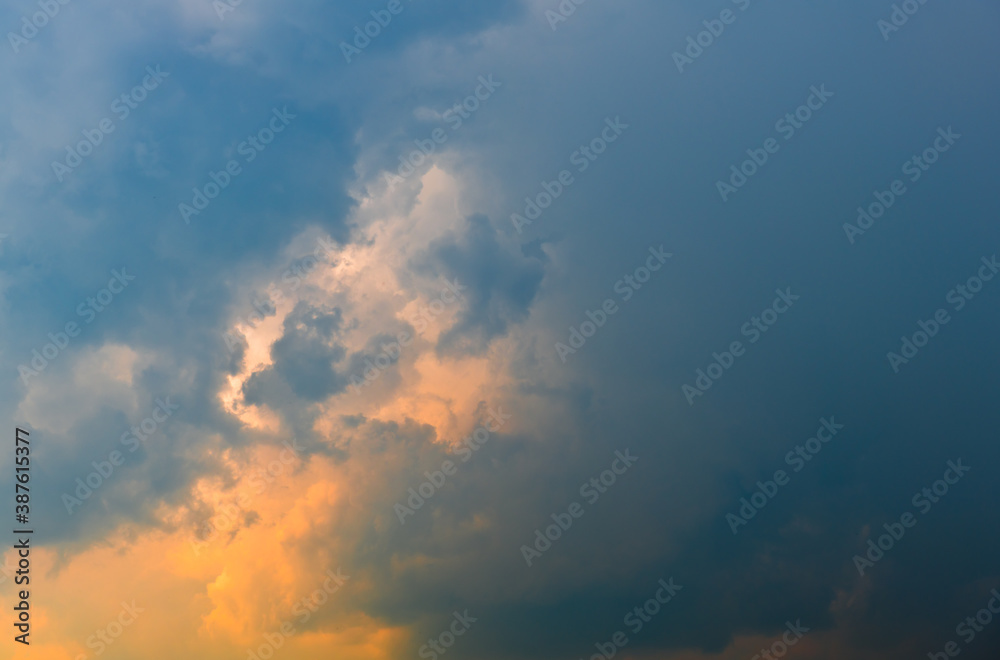 Yellow and black clouds in the sunset sky (background) Yellow and black clouds in the sunset sky (background)