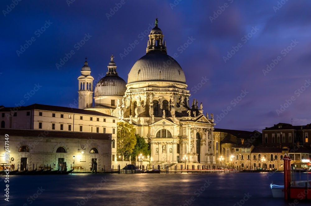 The Basilica of St Mary of Health or Basilica di Santa Maria della Salute at grand canal at night in Venice, Italy