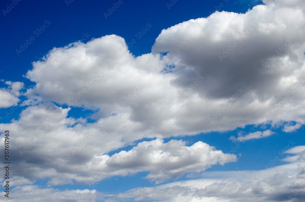 Fototapeta premium White clouds on a blue sky. Background.