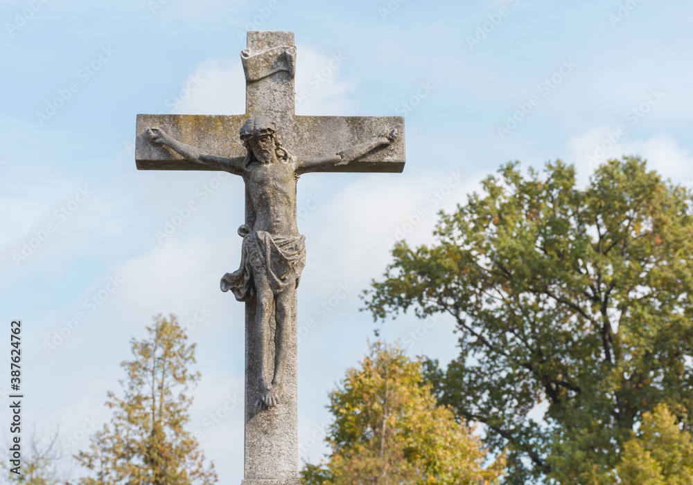 Old statue of Jesus Christ on the cross. Crucifixion, religion and spirituality