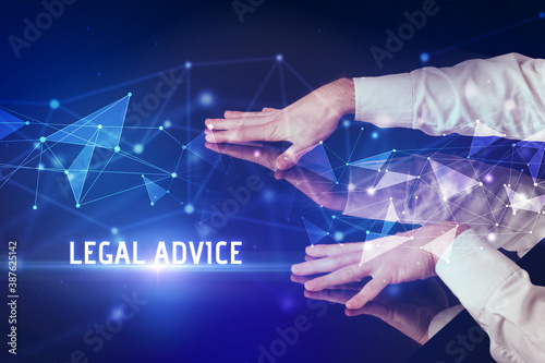 Businessman touching huge screen with LEGAL ADVICE inscription, modern technology business concept