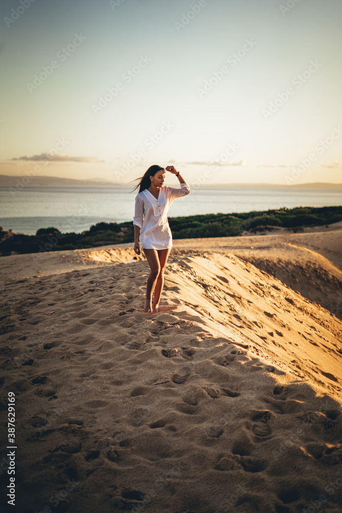 moroccan girl in the dunes of the south of spain and beach coast white tarifa bolonia
